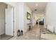 Bright hallway with a bench, lanterns, and a view into the living room at 252 Walkers Point Dr, Auburndale, FL 33823