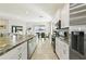 Modern kitchen boasts stainless steel appliances and an island at 252 Walkers Point Dr, Auburndale, FL 33823