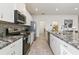 Clean modern kitchen with stainless steel appliances and an island at 252 Walkers Point Dr, Auburndale, FL 33823