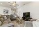 Bright living room with ample seating around a coffee table at 252 Walkers Point Dr, Auburndale, FL 33823