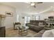 Spacious living room with sectional sofa and glass coffee table at 252 Walkers Point Dr, Auburndale, FL 33823