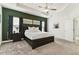 Spacious main bedroom with a king-size bed and an accent wall at 252 Walkers Point Dr, Auburndale, FL 33823