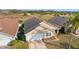 Aerial view of house with garage and landscaping at 2752 Rochelle Dr, Winter Haven, FL 33881