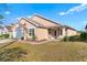 Tan house with white garage door and stone accents at 2752 Rochelle Dr, Winter Haven, FL 33881