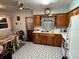 Bright kitchen with wood cabinets and tiled floor at 2810 Avenue U Nw, Winter Haven, FL 33881