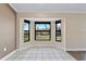 Sunny dining area with large bay windows, offering natural light and a view of the outdoors at 2913 Forestgreen N Dr, Lakeland, FL 33811