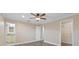 Main bedroom featuring wood floors, walk-in closet, and en-suite bath at 2913 Forestgreen N Dr, Lakeland, FL 33811