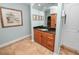 Bathroom vanity with granite countertop and wood cabinets at 304 E Palm Dr, Lakeland, FL 33803