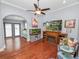 Living room with hardwood floors, fireplace, and built-ins at 304 E Palm Dr, Lakeland, FL 33803