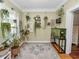 Sunroom with hardwood floors, many plants, and a fish tank at 304 E Palm Dr, Lakeland, FL 33803