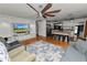 Open layout showcases living area flowing into the kitchen with a butcher block island at 3920 Timberlake E Rd, Lakeland, FL 33810