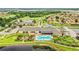 Aerial view of community clubhouse, pool, and golf course at 4128 Aberdeen Ln, Lake Wales, FL 33859