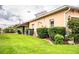 Landscaped backyard with lush lawn and manicured hedges at 4128 Aberdeen Ln, Lake Wales, FL 33859