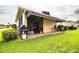 Private backyard oasis with patio, grill, and lush lawn at 4128 Aberdeen Ln, Lake Wales, FL 33859