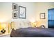 Bright bedroom with a comfortable bed and artwork on the wall at 4128 Aberdeen Ln, Lake Wales, FL 33859