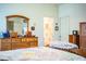 Well-appointed bedroom with wood furniture and ample closet space at 4128 Aberdeen Ln, Lake Wales, FL 33859