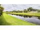 Peaceful canal view with lush greenery and reflective water at 4128 Aberdeen Ln, Lake Wales, FL 33859