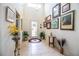 Bright entryway with high ceilings, decorative artwork, and tiled floors at 4128 Aberdeen Ln, Lake Wales, FL 33859