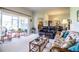 Relaxing living room with comfy seating, glass-top coffee table, and access to patio at 4128 Aberdeen Ln, Lake Wales, FL 33859