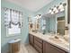 Clean bathroom with dual sinks and a shower at 4128 Mather W Rd, Lakeland, FL 33810