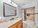 Clean bathroom with tiled shower/tub combo and wood vanity at 4128 Mather W Rd, Lakeland, FL 33810
