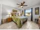 Cozy bedroom with a queen-size bed and large window at 4128 Mather W Rd, Lakeland, FL 33810