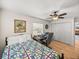 Comfortable bedroom with hardwood floors, a desk and large closet at 4128 Mather W Rd, Lakeland, FL 33810