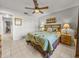 Bright bedroom with a comfortable bed and ceiling fan at 4128 Mather W Rd, Lakeland, FL 33810
