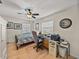 Bedroom with hardwood floors, built-in desk and ceiling fan at 4128 Mather W Rd, Lakeland, FL 33810