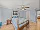 Comfortable bedroom with hardwood floors and ceiling fan at 4128 Mather W Rd, Lakeland, FL 33810