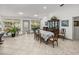 Dining area with table, chairs, and access to screened porch at 4128 Mather W Rd, Lakeland, FL 33810