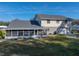 Aerial view of a house with a screened porch and a large backyard at 4128 Mather W Rd, Lakeland, FL 33810