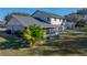 Two-story house with a large screened porch and nicely landscaped yard at 4128 Mather W Rd, Lakeland, FL 33810