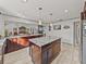 Open kitchen with large island, granite countertops and stainless steel appliances at 4128 Mather W Rd, Lakeland, FL 33810
