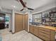 Laundry room with sink, cabinets, and access to living area at 4128 Mather W Rd, Lakeland, FL 33810