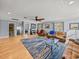 Bright living room with hardwood floors, ceiling fan, and views of other rooms at 4128 Mather W Rd, Lakeland, FL 33810