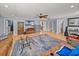 Open living area with hardwood floors, comfortable seating and built in shelving at 4128 Mather W Rd, Lakeland, FL 33810