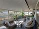 Relaxing screened porch with wicker furniture and plants at 4128 Mather W Rd, Lakeland, FL 33810