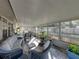 Large screened porch featuring comfortable wicker seating at 4128 Mather W Rd, Lakeland, FL 33810