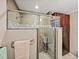 Large walk-in shower with glass enclosure and pebble floor at 4128 Mather W Rd, Lakeland, FL 33810
