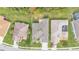 Aerial view of a home with a backyard with a large green lawn and landscaping at 4145 Whistlewood Cir, Lakeland, FL 33811