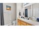 Bathroom with a single sink and a shower/tub with a neutral shower curtain at 4145 Whistlewood Cir, Lakeland, FL 33811