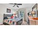 Bedroom with a bed and ceiling fan and a view of the front yard at 4145 Whistlewood Cir, Lakeland, FL 33811