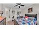 Bedroom with a ceiling fan, carpet and closet at 4145 Whistlewood Cir, Lakeland, FL 33811