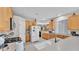 Bright kitchen with stainless steel appliances, and light wood cabinets at 4145 Whistlewood Cir, Lakeland, FL 33811