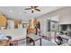 Open-concept living room featuring hardwood floors, and a sliding door to the backyard at 4145 Whistlewood Cir, Lakeland, FL 33811