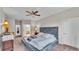 Spacious main bedroom with a ceiling fan, and access to the ensuite bathroom at 4145 Whistlewood Cir, Lakeland, FL 33811