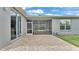 A screened patio is accessible from multiple points and sits on a brick-paved area at 4145 Whistlewood Cir, Lakeland, FL 33811