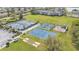 Aerial view of community recreation area with tennis courts, basketball court and playground at 4145 Whistlewood Cir, Lakeland, FL 33811