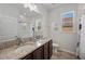 Double vanity bathroom with granite countertops and a shower/tub combo at 4215 Prima Lago Dr, Lakeland, FL 33810